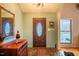 Elegant entryway with hardwood floors and a decorative mirror at 135 Weatherbend, Pittsboro, NC 27312