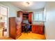 Bright home office features built-in wood desk and cabinets at 135 Weatherbend, Pittsboro, NC 27312