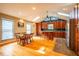 Bright kitchen boasts an island, hardwood floors, and a breakfast nook at 135 Weatherbend, Pittsboro, NC 27312