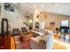 Large living area with hardwood floors, sectional sofa, and a high ceiling at 135 Weatherbend, Pittsboro, NC 27312