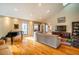 Spacious living room with hardwood floors, large windows, and a piano at 135 Weatherbend, Pittsboro, NC 27312
