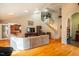 Open living room showcasing hardwood floors and access to kitchen at 135 Weatherbend, Pittsboro, NC 27312
