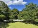Lush foliage surrounds the property providing a private and scenic view at 135 Weatherbend, Pittsboro, NC 27312