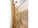 Large walk-in shower with beige tile and handheld shower head at 135 Weatherbend, Pittsboro, NC 27312