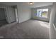 Spacious carpeted bedroom with a large window providing natural light at 150 Steppe Way, Garner, NC 27529