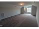 Bright bonus room features plush carpet and a large window, ideal for a playroom or home office at 150 Steppe Way, Garner, NC 27529