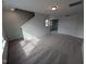 Open bonus room area with stairs and carpet flooring at 150 Steppe Way, Garner, NC 27529