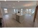 Open-concept kitchen featuring a large island and stainless steel appliances at 150 Steppe Way, Garner, NC 27529