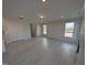 Spacious open-concept living room featuring light-colored flooring at 150 Steppe Way, Garner, NC 27529