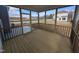 Cozy screened-in porch with wood flooring, offering a relaxing outdoor living space at 150 Steppe Way, Garner, NC 27529