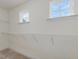 Bright walk-in closet featuring wire shelving, carpeted floor, and natural light at 188 Shelby Meadow Ln, Angier, NC 27501