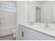 Bright bathroom featuring a double sink vanity with white cabinets and a shower/tub combination at 199 Shelby Meadow Ln, Angier, NC 27501