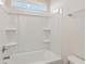Clean bathroom with a tub/shower combination, built-in shelves, and modern fixtures at 199 Shelby Meadow Ln, Angier, NC 27501