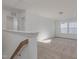 Spacious bonus room with neutral carpet, natural light, and a view of the staircase at 199 Shelby Meadow Ln, Angier, NC 27501