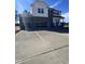 Two-story home with a three-car garage, stone accents, and a concrete driveway at 199 Shelby Meadow Ln, Angier, NC 27501