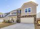Beautiful two-story home featuring stone accents and a convenient two-car garage at 199 Shelby Meadow Ln, Angier, NC 27501