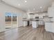 Spacious kitchen with white cabinets, granite countertops, stainless appliances, and sliding glass door at 199 Shelby Meadow Ln, Angier, NC 27501
