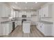 Beautiful kitchen featuring white cabinetry, stainless steel appliances, granite counters and center island at 199 Shelby Meadow Ln, Angier, NC 27501