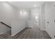 Upstairs hallway with neutral carpet, white trim, and access to multiple rooms at 281 Chesapeake Commons St # 95, Garner, NC 27529