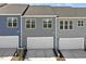 The new townhomes have neutral siding, driveways, and attached garages at 281 Chesapeake Commons St # 95, Garner, NC 27529