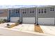 New townhomes offer neutral siding, driveways, and attached garages at 281 Chesapeake Commons St # 95, Garner, NC 27529