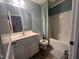 Well-maintained bathroom with a vanity sink, toilet, and shower/tub combination at 374 W Falcon Ct, Clayton, NC 27520