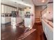 Well-equipped kitchen with white cabinetry, a center island, and stainless steel appliances at 374 W Falcon Ct, Clayton, NC 27520