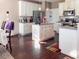 Modern kitchen with white cabinets, stainless steel appliances, and hardwood flooring at 374 W Falcon Ct, Clayton, NC 27520
