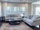 Comfortable living room with plush sofas, a coffee table, and bright natural light at 374 W Falcon Ct, Clayton, NC 27520