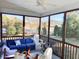Relaxing screened porch with comfortable seating and views of the surrounding landscape at 374 W Falcon Ct, Clayton, NC 27520