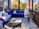 Relaxing screened porch with comfortable seating and a view of the backyard at 374 W Falcon Ct, Clayton, NC 27520