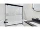 Modern bathroom showcasing white subway tile in the shower with black trim and a stylish vanity at 414 S B Harrison Ln, Henderson, NC 27537