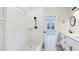 Modern bathroom with a walk-in shower, sleek fixtures, and a view into an adjoining bedroom at 414 S B Harrison Ln, Henderson, NC 27537