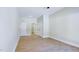 Bright bedroom with wood floors, two doorways, and trim detail at 414 S B Harrison Ln, Henderson, NC 27537