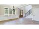 Inviting entryway with wood floors, wainscoting, and a staircase, exuding elegance and charm at 414 S B Harrison Ln, Henderson, NC 27537