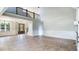 Grand foyer boasting soaring ceilings, elegant wainscoting, wood floors, and a beautiful staircase at 414 S B Harrison Ln, Henderson, NC 27537