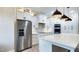 Modern kitchen with stainless steel appliances, quartz countertop island, and elegant pendant lights at 414 S B Harrison Ln, Henderson, NC 27537