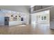 Spacious living room featuring an open floor plan with kitchen and a beautiful chandelier at 414 S B Harrison Ln, Henderson, NC 27537