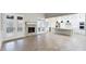 Open-concept view of the living room with fireplace and kitchen at 414 S B Harrison Ln, Henderson, NC 27537