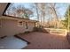 Backyard deck and patio with wooden railings, and an exterior view of the house at 6512 Johnsdale Rd, Raleigh, NC 27615