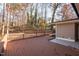 Wide, open, backyard deck surrounded by a canopy of trees at 6512 Johnsdale Rd, Raleigh, NC 27615