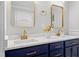 Stylish bathroom features double sink vanity, quartz countertop and modern gold fixtures at 6512 Johnsdale Rd, Raleigh, NC 27615