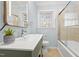 Bathroom boasting a tub/shower combo and modern vanity at 6512 Johnsdale Rd, Raleigh, NC 27615