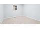 Neutral bedroom with plush carpet and natural light at 6512 Johnsdale Rd, Raleigh, NC 27615
