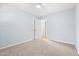 Neutral bedroom with a ceiling fan and a doorway to another room at 6512 Johnsdale Rd, Raleigh, NC 27615