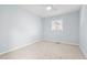 Neutral bedroom with plush carpet and natural light at 6512 Johnsdale Rd, Raleigh, NC 27615