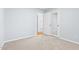 Neutral bedroom with plush carpet and natural light at 6512 Johnsdale Rd, Raleigh, NC 27615