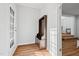 Inviting entryway with stylish bench and coat rack, with wooden floors, and a bright view at 6512 Johnsdale Rd, Raleigh, NC 27615