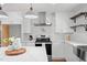 Modern kitchen with stainless steel appliances and white cabinets, countertop and backsplash at 6512 Johnsdale Rd, Raleigh, NC 27615