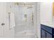 Bathroom boasting a sleek, glass-enclosed shower with gold fixtures and marble tile at 6512 Johnsdale Rd, Raleigh, NC 27615